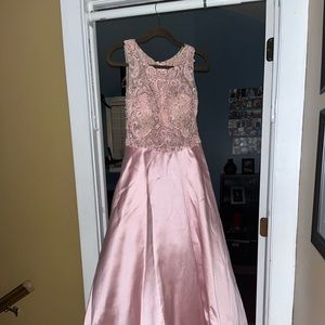 A baby pink silky prom dress, includes pockets. Like new, only worn for an hour
